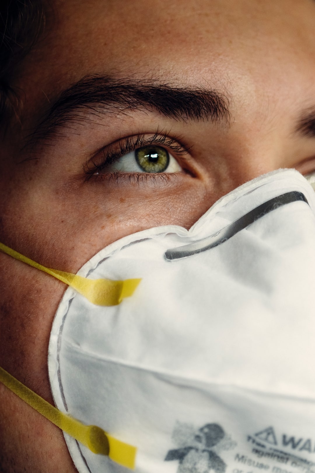 Man wearing a mask over face