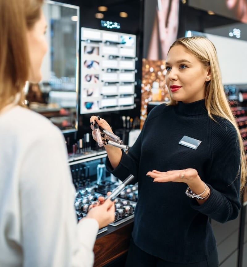 Sales associate selling makeup
