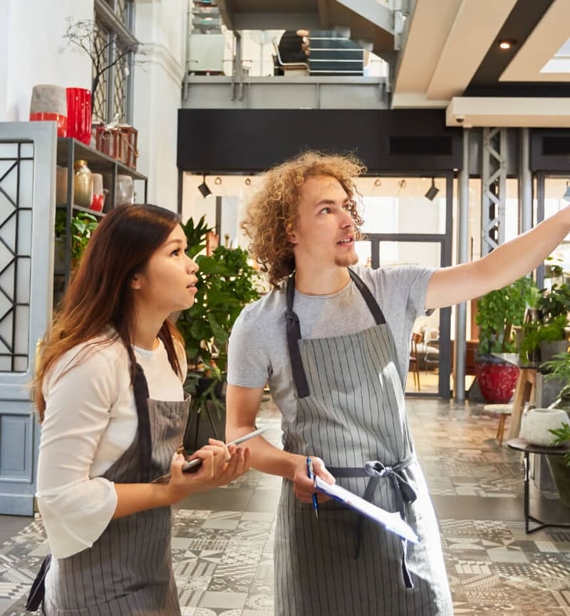 Restaurant employee training a new hire