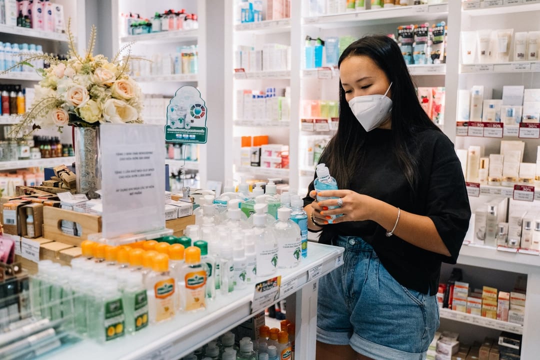 woman wearing a mask shopping in a pharmacy