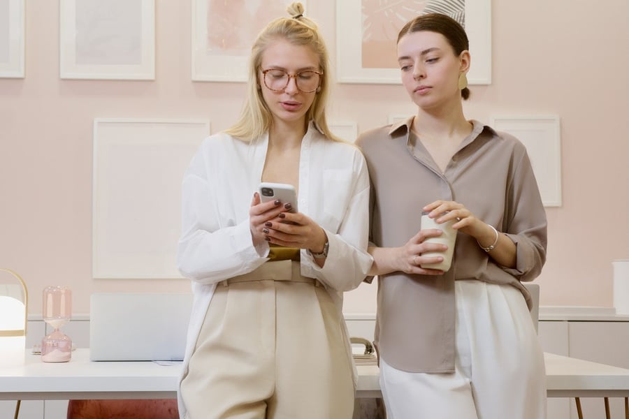 retail employees on mobile device